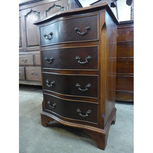 166 - A small mahogany serpentine chest of drawers