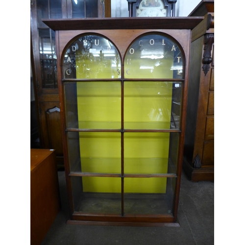 169 - A Victorian mahogany cabinet, bearing Cadbury's Chocolate inscription to door