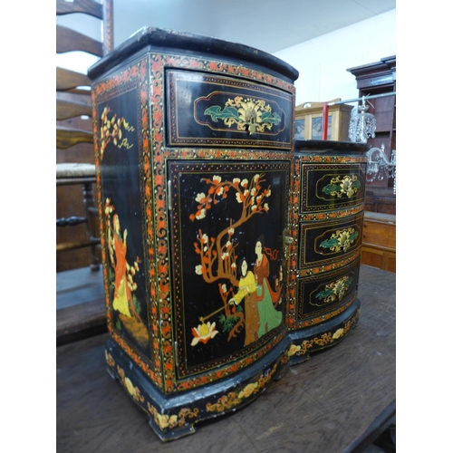 174 - An oriental black chinoiserie lacquered side cabinet