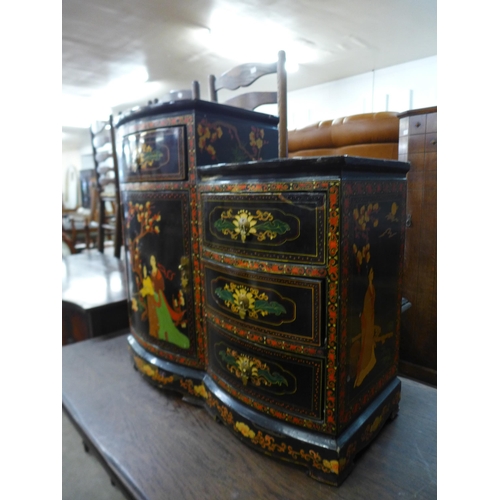 174 - An oriental black chinoiserie lacquered side cabinet