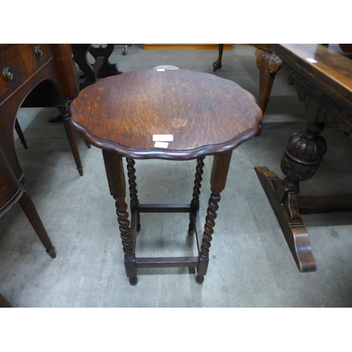 176 - An oak barleytwist occasional table