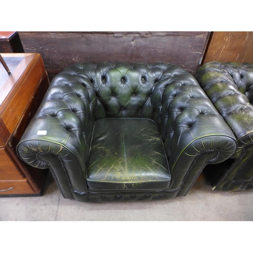 179 - A pair of green leather Chesterfield armchairs