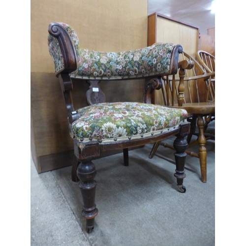 181 - A Victorian Aesthetic Movement mahogany and fabric upholstered library chair