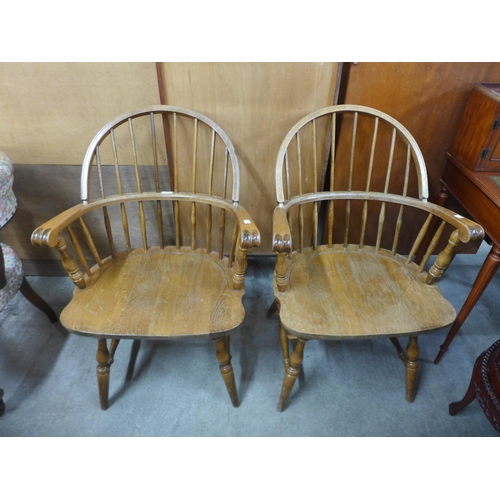 182 - A pair of American oak elbow chairs