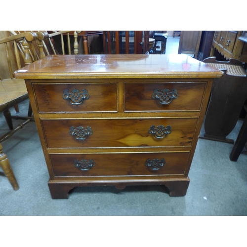 183a - A small George III style yew wood chest of drawers