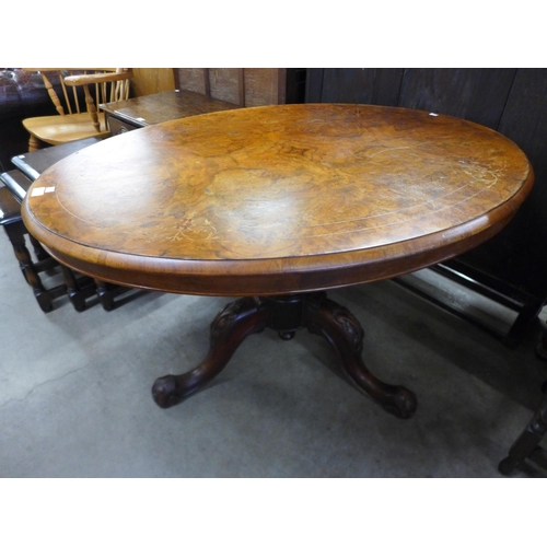 191 - A Victorian inlaid walnut oval loo table