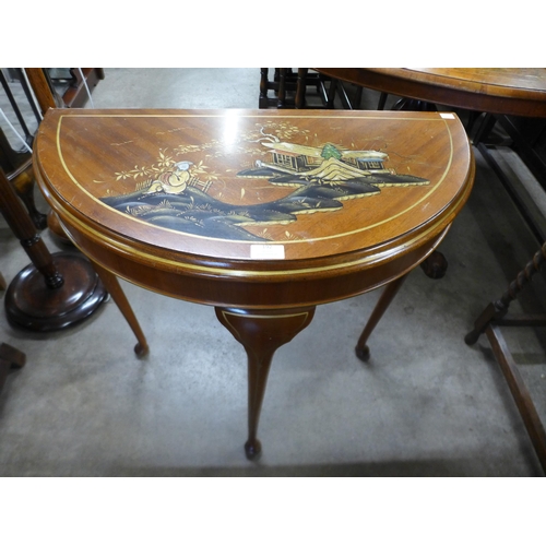 192 - A Japanned mahogany demi lune hall table