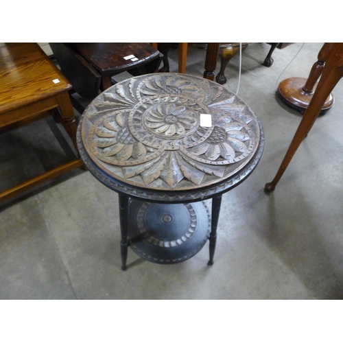 194 - A Victorian carved oak circular occasional table