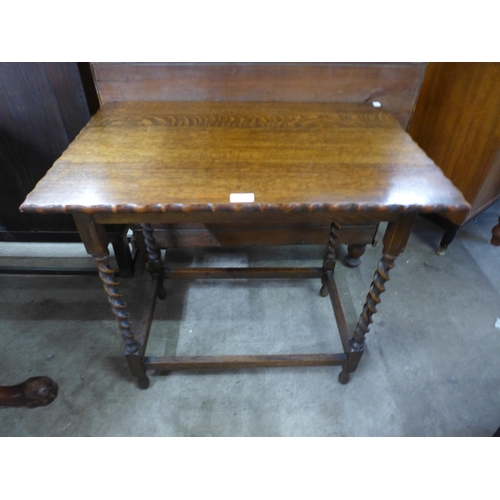 195 - An oak barleytwist occasional table