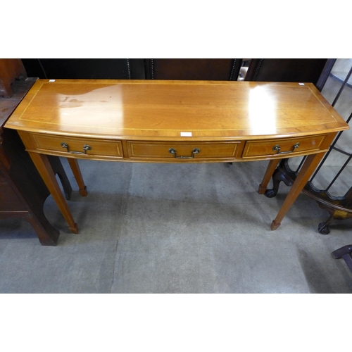 201 - An inlaid walnut three drawer console table