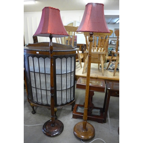 204 - Two oak standard lamps