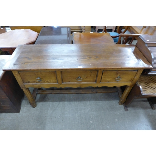 210 - A George III style elm and yew wood dresser