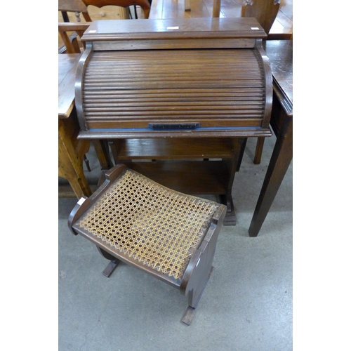 211 - A small oak tambour roll-top desk and a stool