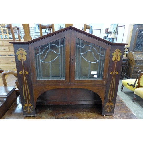 212 - An Art Nouveau inlaid mahogany table top cabinet