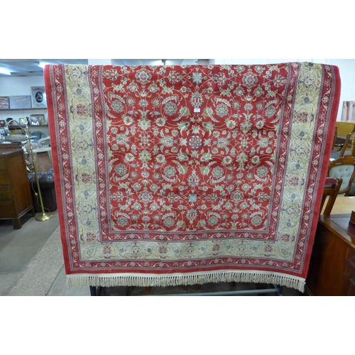 216 - A red ground rug