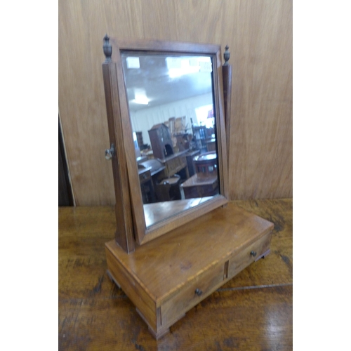 217 - A George III style mahogany two drawer toilet mirror