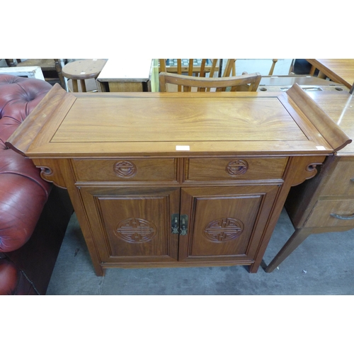 253 - A Chinese hardwood sideboard