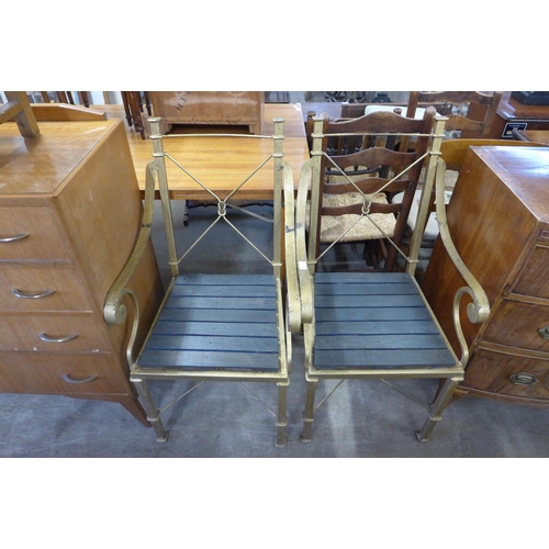 255 - A pair of gilt metal garden chairs