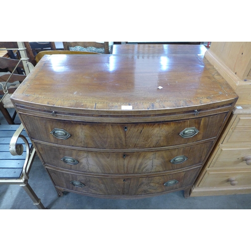 256 - A George III inlaid mahogany bow front chest of drawers