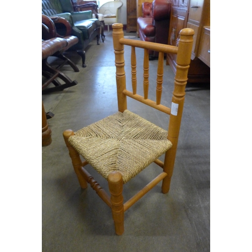 257 - A child's beech rush seated chair