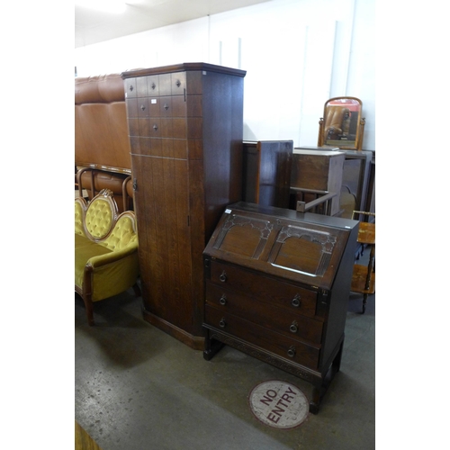 269 - A carved oak hall robe and a carved oak bureau