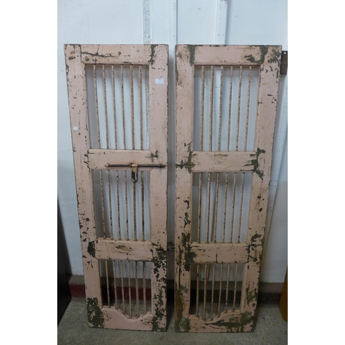 276 - A pair of painted metal and hardwood doors