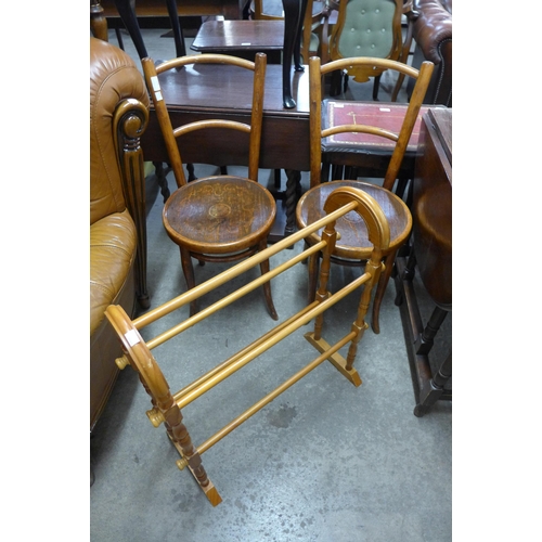 279 - A pair of beech bentwood chairs and a pine towel rail