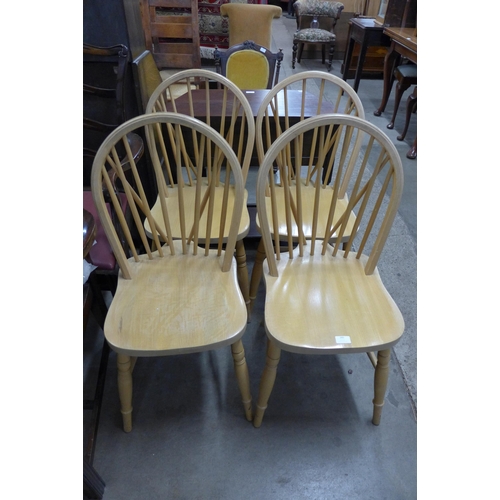 285 - A set of four beech kitchen chairs