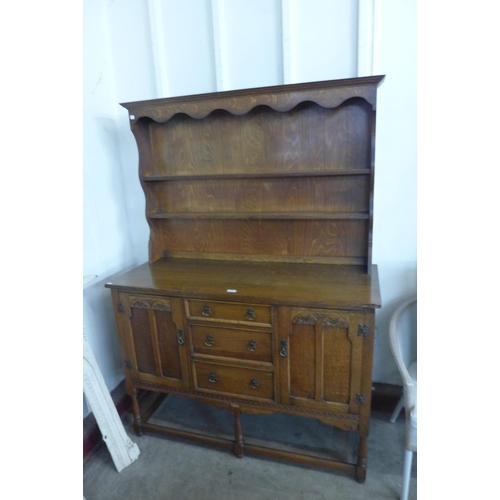 294 - A carved oak dresser