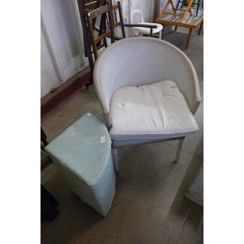 295 - A Lloyd Loom armchair and a linen box