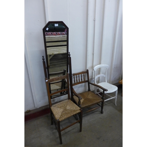 296 - A mahogany cheval mirror, two rush seated chairs and a Victorian painted kitchen chair