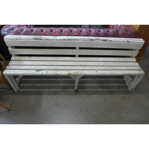 298 - A painted pine garden bench