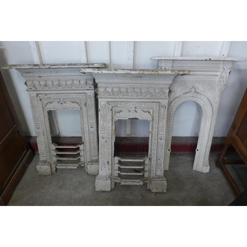 299 - Three Victorian painted cast iron fire surrounds