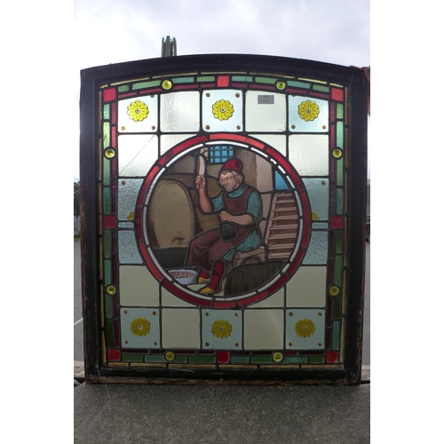 308 - A 19th Century Flemish stained glass window, depicting a winemaker bottling wine, 80 x 67cms