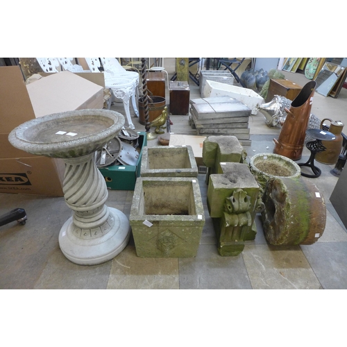 313 - Assorted concrete planters, a bird bath, mill stone etc.