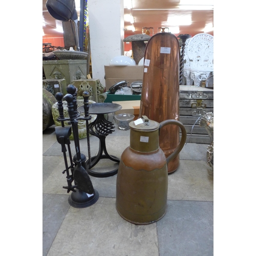 316 - A copper coal hod, a copper and brass jug, a companion set and a candle stand