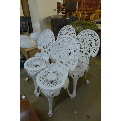 323 - A set of four painted cast alloy garden chairs