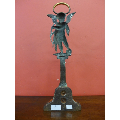 4 - A Victorian brass cast iron based door porter, depicting Cupid