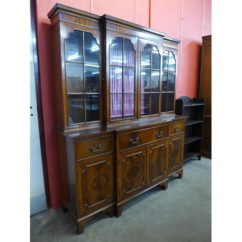 47 - A George III style mahogany breakfront secretarie bookcase