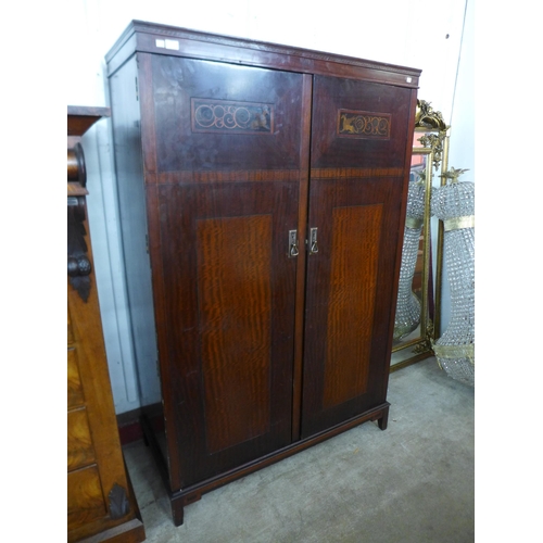 53 - An Art Deco inlaid mahogany fitted compactum style wardrobe