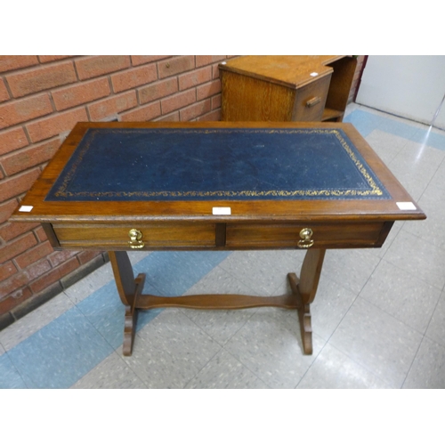 60 - A Victorian ash two drawer writing table