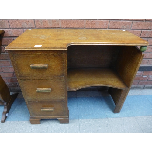 61 - An Art deco oak desk, manner of Heals