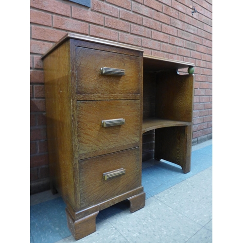 61 - An Art deco oak desk, manner of Heals