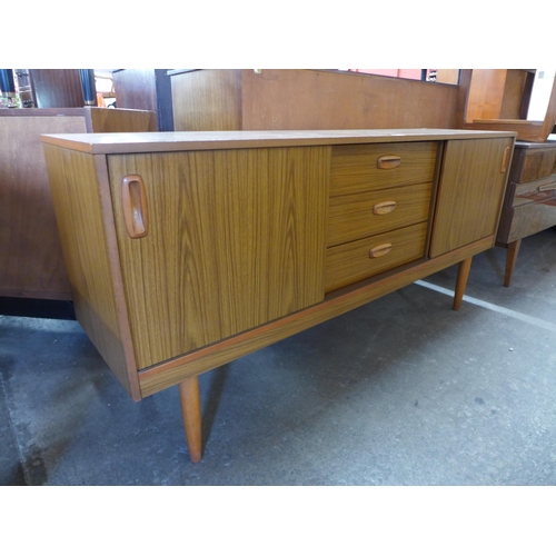 73 - A teak sideboard