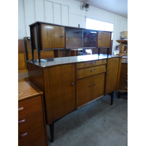 79 - A Nathan tola wood highboard