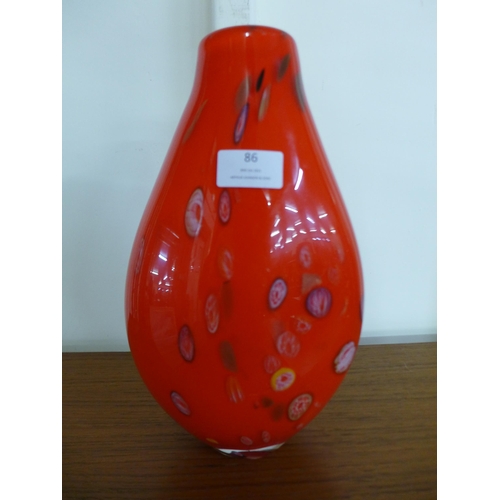 86 - An Italian Murano red glass millefiory vase