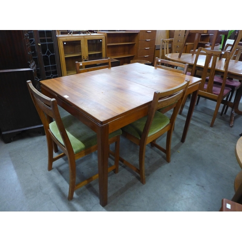 87 - A McIntosh teak extending dining table and four chairs