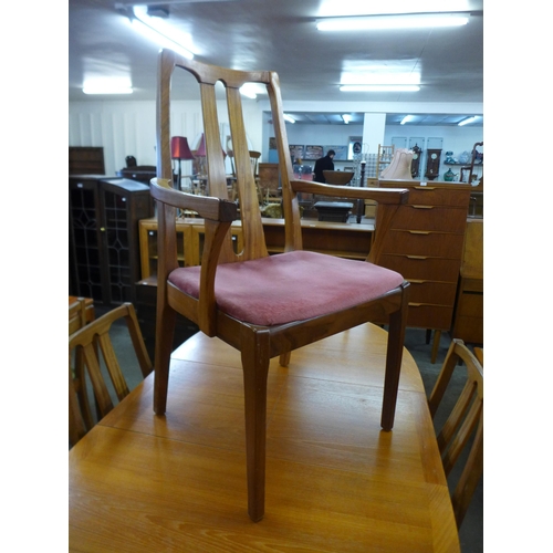 90 - A teak extending dining table and a set of five Nathan teak dining chairs