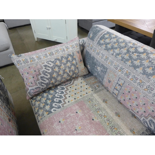 1349 - A blue, pink and cream upholstered four seater sofa