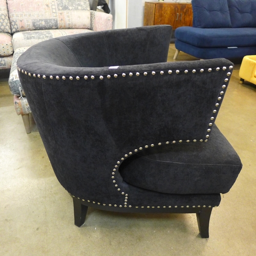 1353 - A black velvet studded armchair